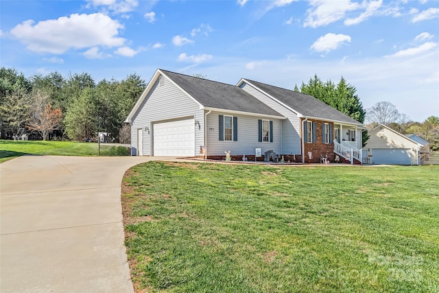 ranch-style home featuring a garage and a front lawn