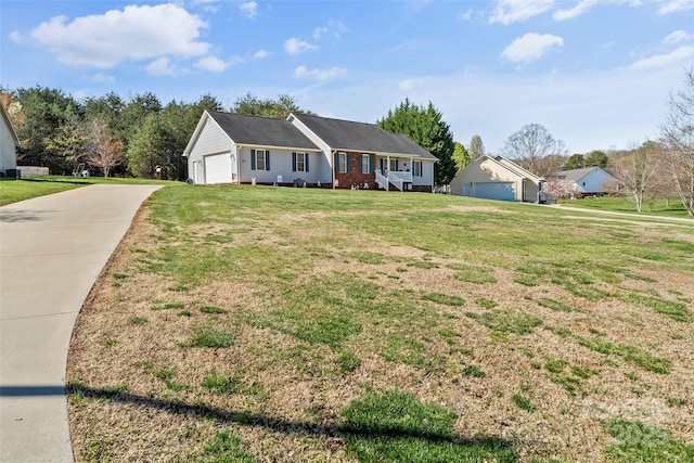 ranch-style house with a front lawn and a garage