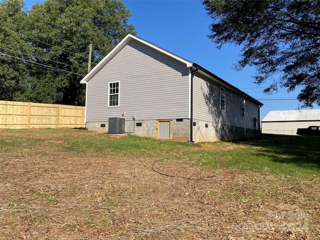 view of side of property featuring central air condition unit