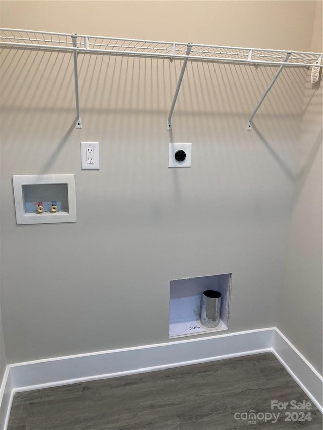 washroom featuring hookup for a washing machine and dark hardwood / wood-style floors