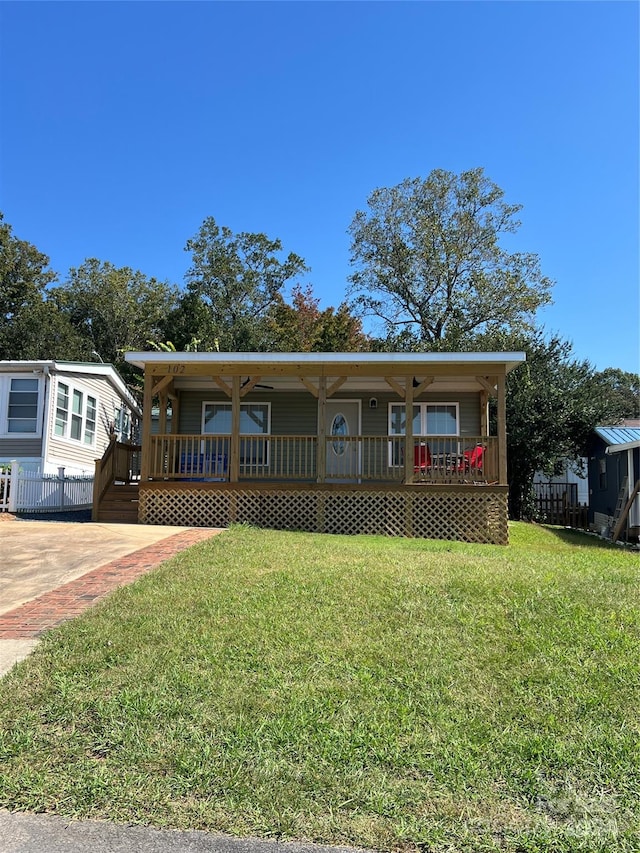 view of front of property with a porch and a front yard