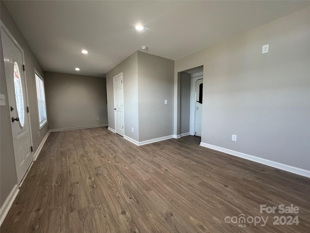 unfurnished room with dark hardwood / wood-style floors