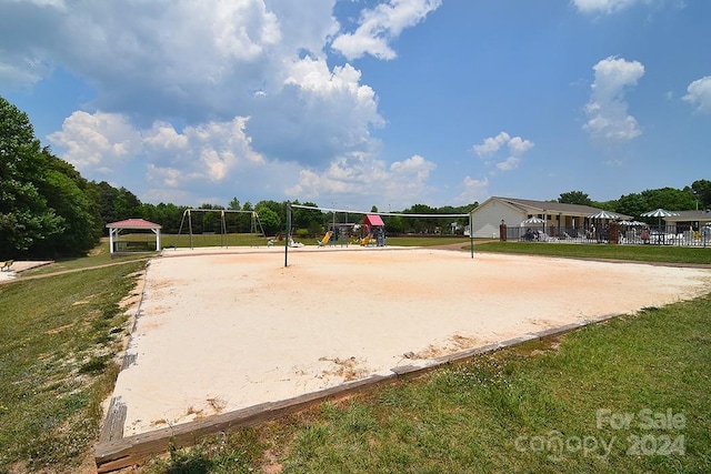 view of home's community with a gazebo, a lawn, and volleyball court