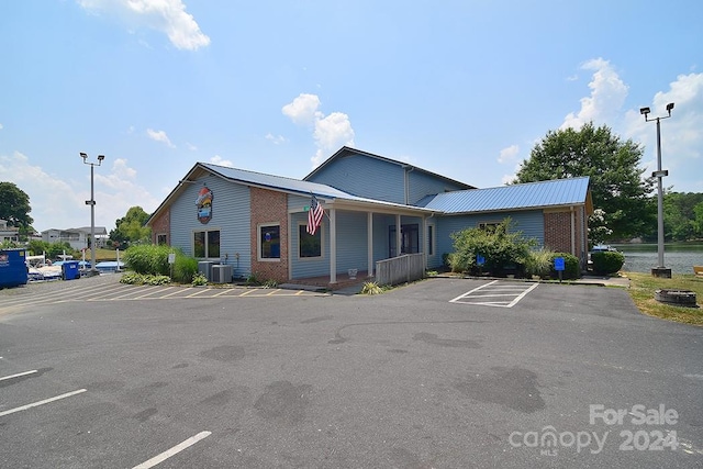 exterior space with cooling unit and covered porch