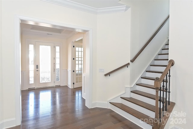 foyer with crown molding and dark hardwood / wood-style flooring