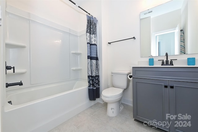 full bathroom featuring vanity, shower / bath combination with curtain, toilet, and tile patterned flooring