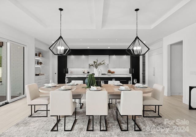 dining area featuring beamed ceiling and light wood-type flooring