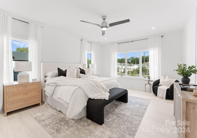 bedroom featuring ceiling fan and light hardwood / wood-style flooring