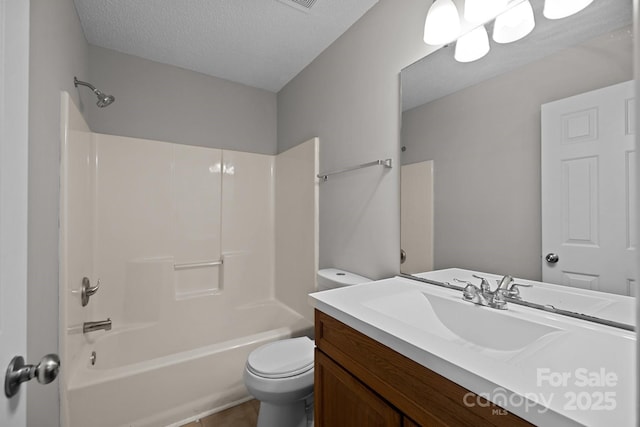 full bathroom featuring vanity, tile patterned flooring, toilet, a textured ceiling, and shower / bath combination