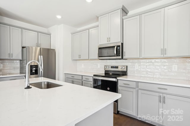 kitchen with decorative backsplash, dark hardwood / wood-style floors, sink, and stainless steel appliances