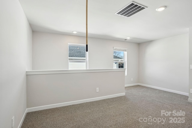 unfurnished room with carpet floors