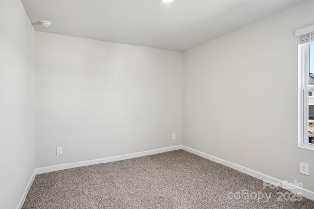 empty room with carpet flooring