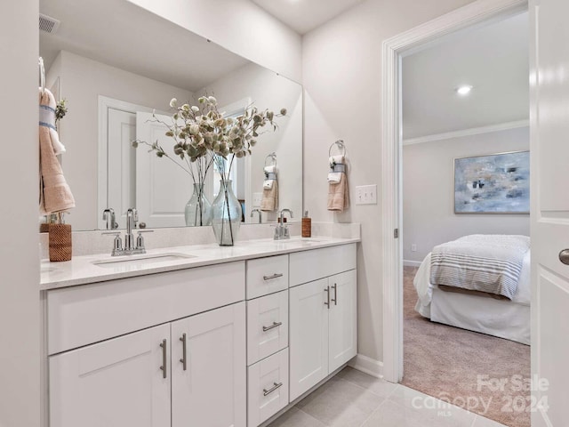 bathroom featuring vanity, ornamental molding, and tile patterned floors