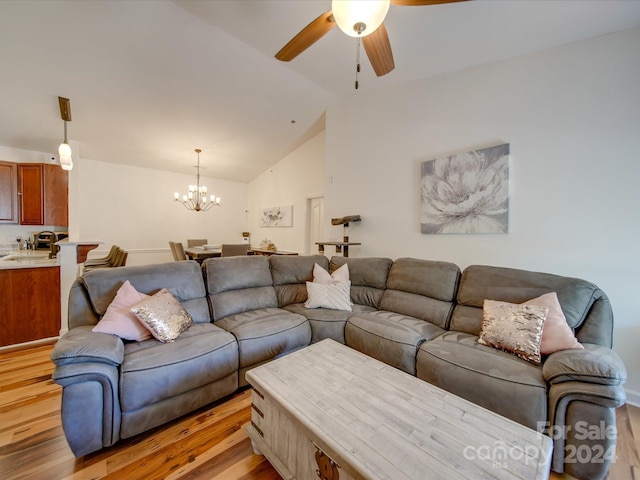 11719 Ridgeway Park Dr, Charlotte, NC 28277 - living area featuring a chandelier, light wood-type flooring, a ceiling fan, and lofted ceiling