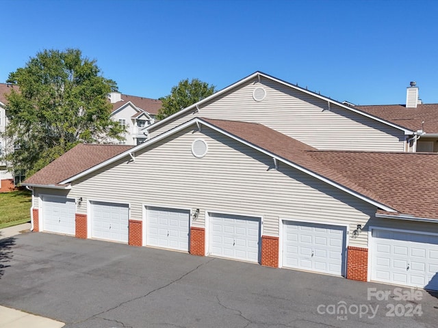 view of property exterior with a garage