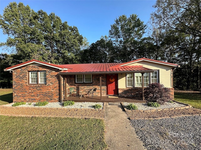 ranch-style home with a front lawn