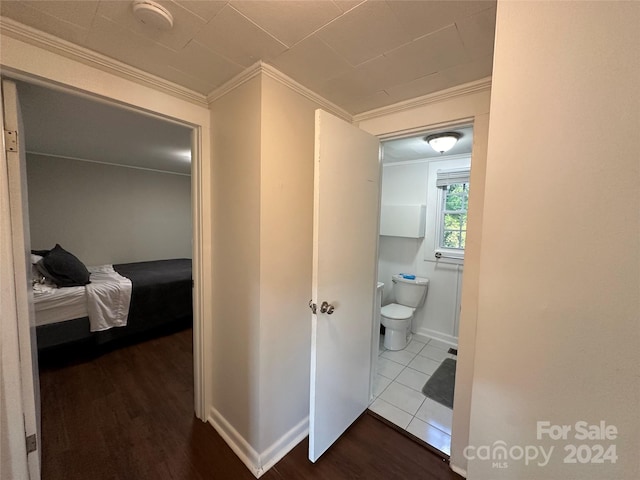 hall with crown molding and hardwood / wood-style floors