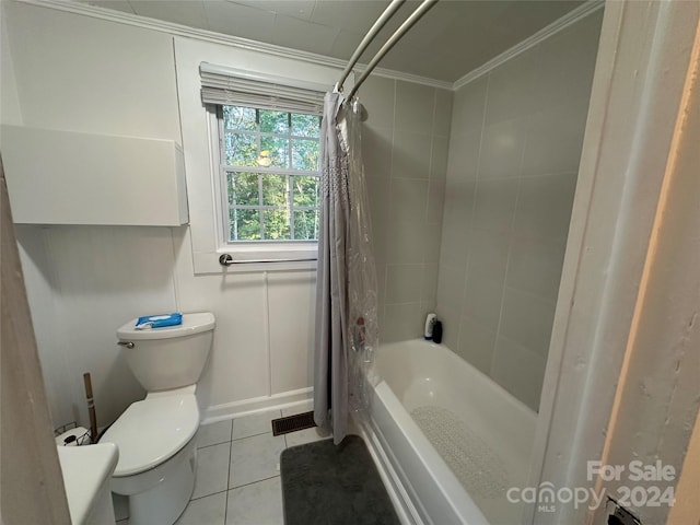 bathroom featuring crown molding, toilet, tile patterned flooring, and shower / bath combination with curtain