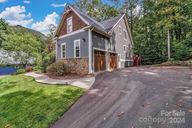 view of property exterior with a garage and a yard