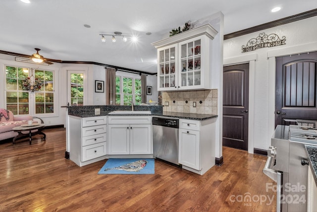 kitchen with crown molding, dark hardwood / wood-style flooring, sink, stainless steel appliances, and white cabinetry