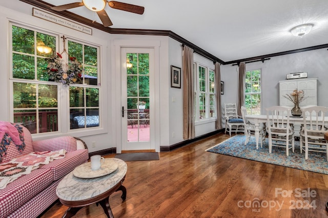 dining room featuring ornamental molding, ceiling fan, and wood-type flooring