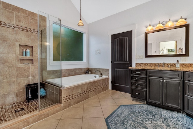 bathroom with vanity, tile patterned flooring, vaulted ceiling, and shower with separate bathtub