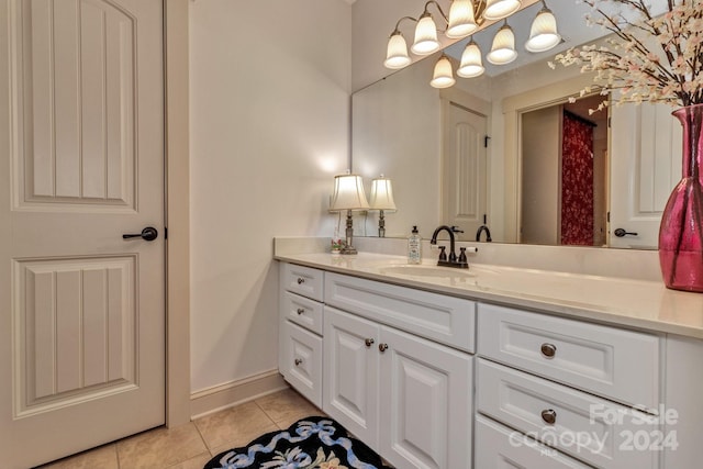 bathroom with tile patterned flooring and vanity