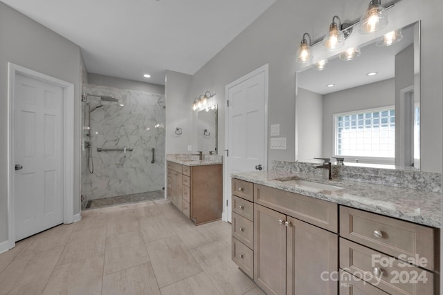 bathroom with vanity and a shower with shower door