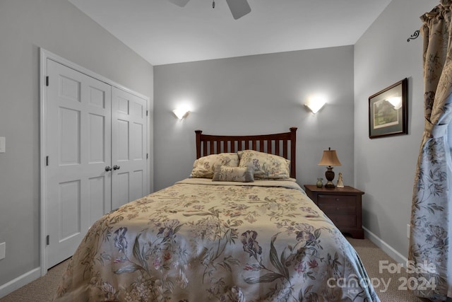 carpeted bedroom with a closet and ceiling fan