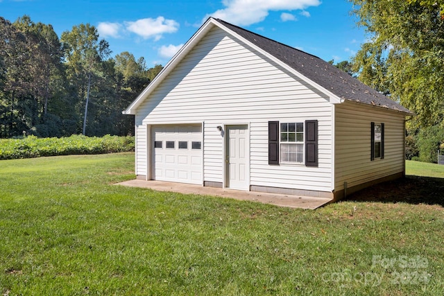 garage featuring a yard