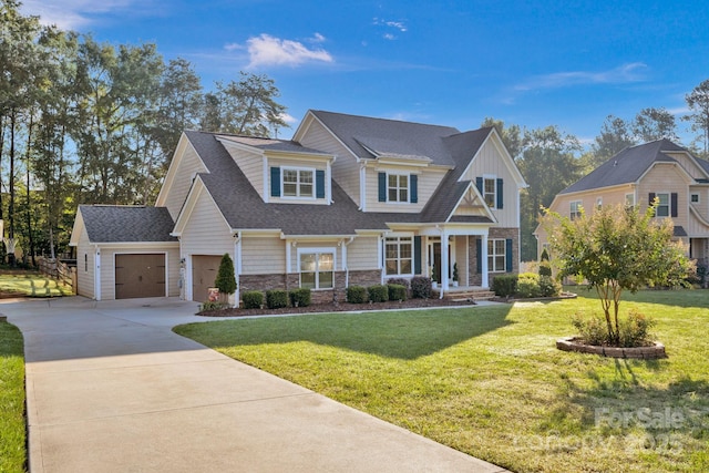 view of front of property featuring a garage and a front yard