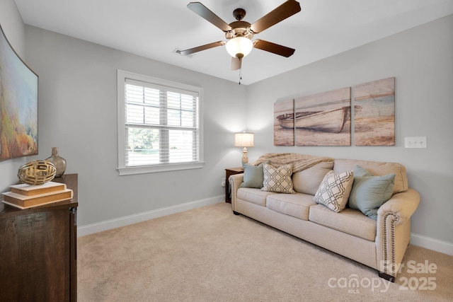 carpeted living room featuring ceiling fan