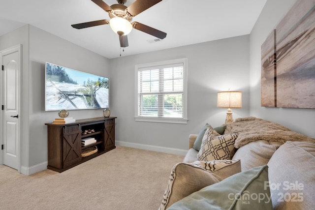 carpeted living room featuring ceiling fan