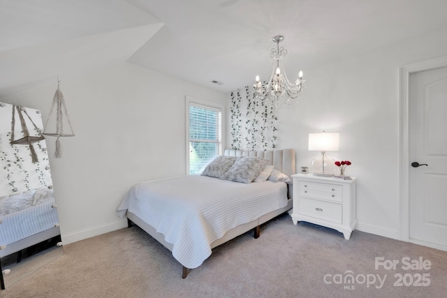 bedroom featuring light colored carpet and an inviting chandelier