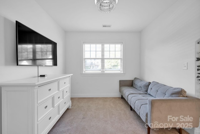 living area with light colored carpet