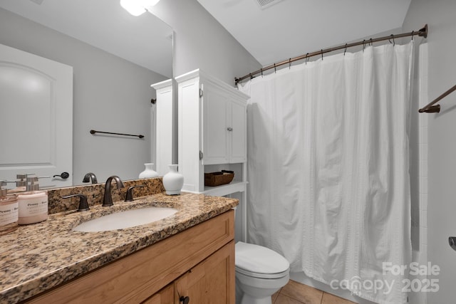 bathroom featuring vanity, toilet, curtained shower, and tile patterned flooring