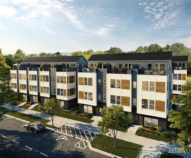 3004 Loso Ter Unit 56, Charlotte, NC 28217 - view of building exterior featuring uncovered parking