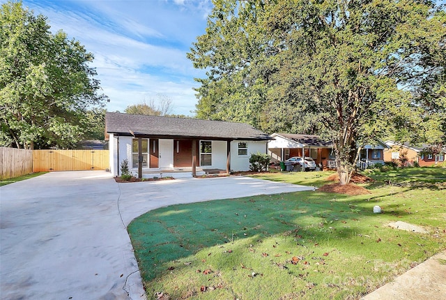 single story home with a front yard and a porch