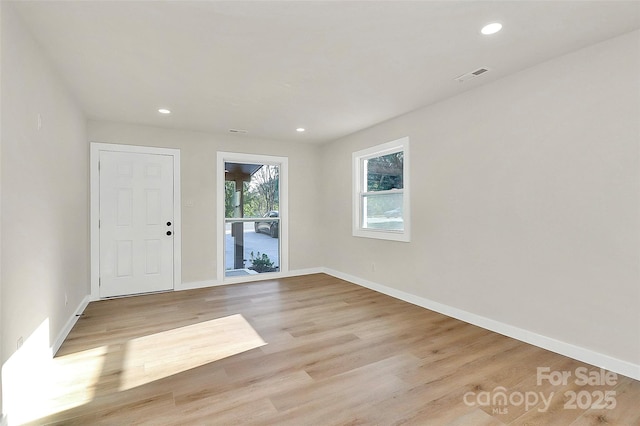 spare room with light wood-type flooring