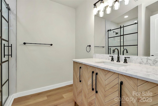 bathroom featuring wood-type flooring and vanity