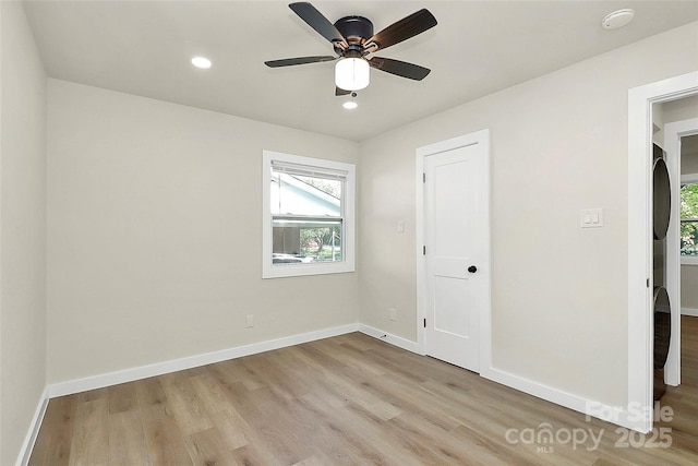 interior space with ceiling fan and light hardwood / wood-style floors