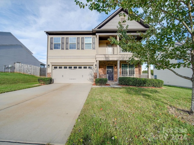 view of front facade with a balcony, a garage, and a front lawn