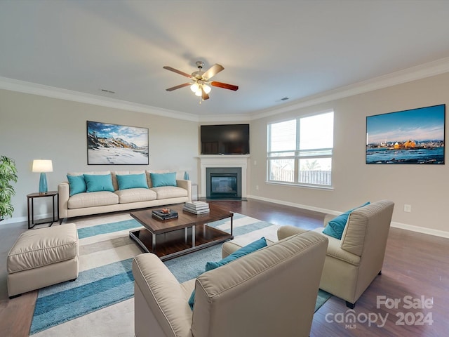 living room featuring ornamental molding, hardwood / wood-style flooring, and ceiling fan