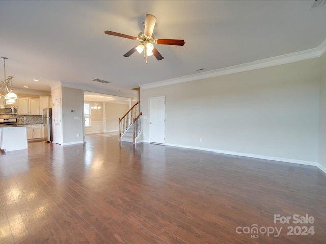 unfurnished living room featuring ornamental molding, dark wood-type flooring, and ceiling fan with notable chandelier