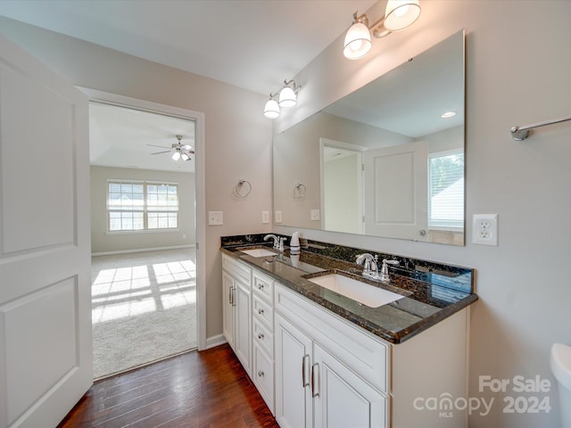 bathroom with vanity, ceiling fan, and hardwood / wood-style flooring