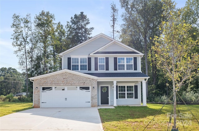 view of front of property with a front lawn and a garage