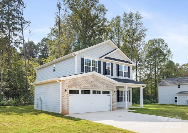 front of property with a front lawn and a garage