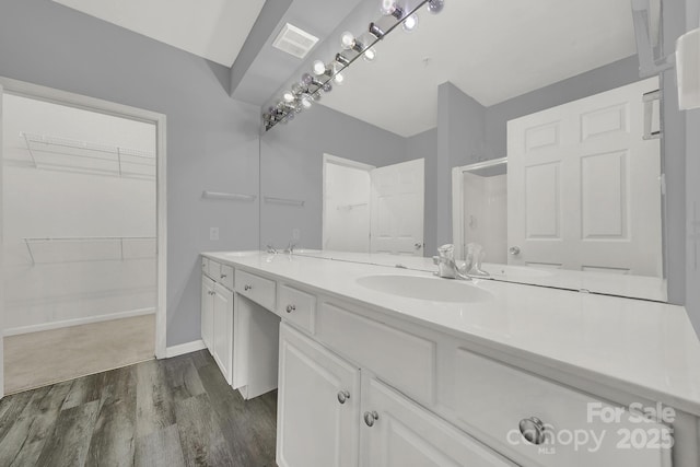 bathroom featuring vanity and wood-type flooring