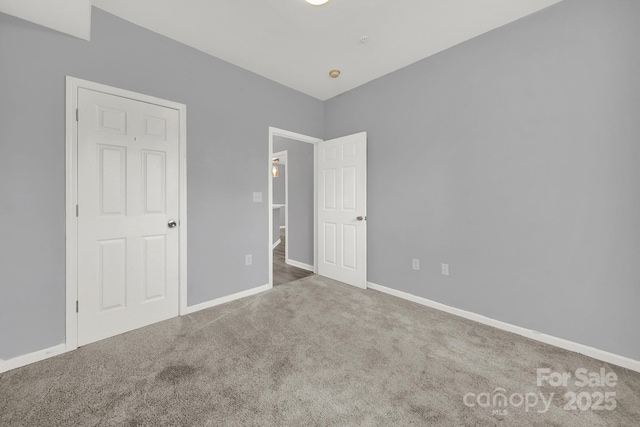 unfurnished bedroom with carpet flooring