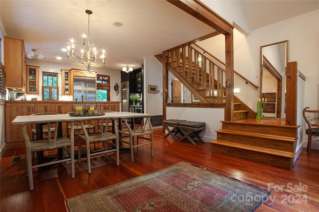 dining room featuring an inviting chandelier and dark hardwood / wood-style flooring